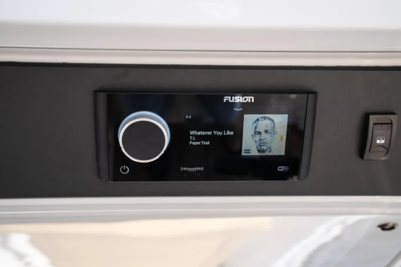 Slide: The Image of 2024 Opus OPUS 12 audio system displaying "Whatever You Like" by T.I. on screen. - 22