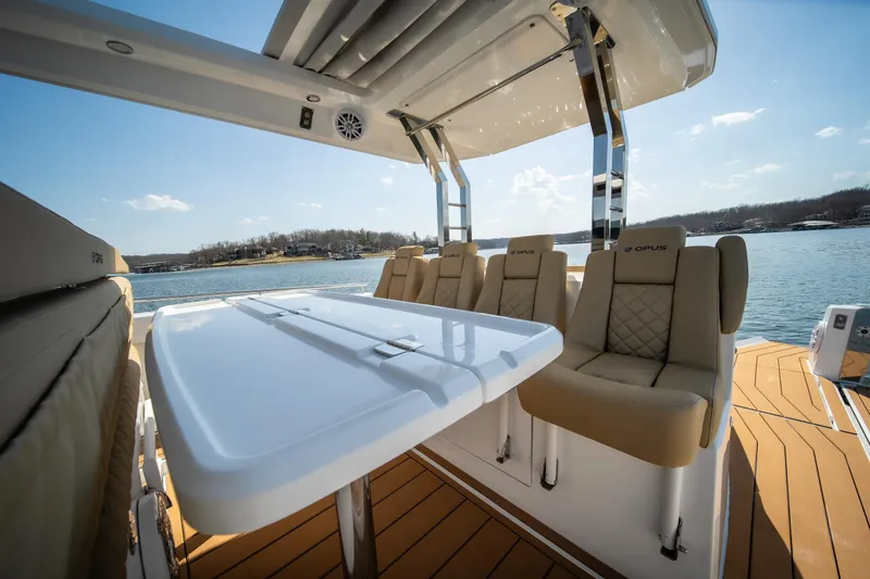 Slide: The Image of Luxurious 2024 Opus OPUS 12 boat interior with plush seating and sleek design on a sunny day. - 24