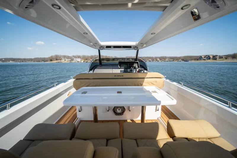 Slide: The Image of Luxurious 2024 Opus OPUS 12 yacht interior with spacious seating and scenic water view. - 27