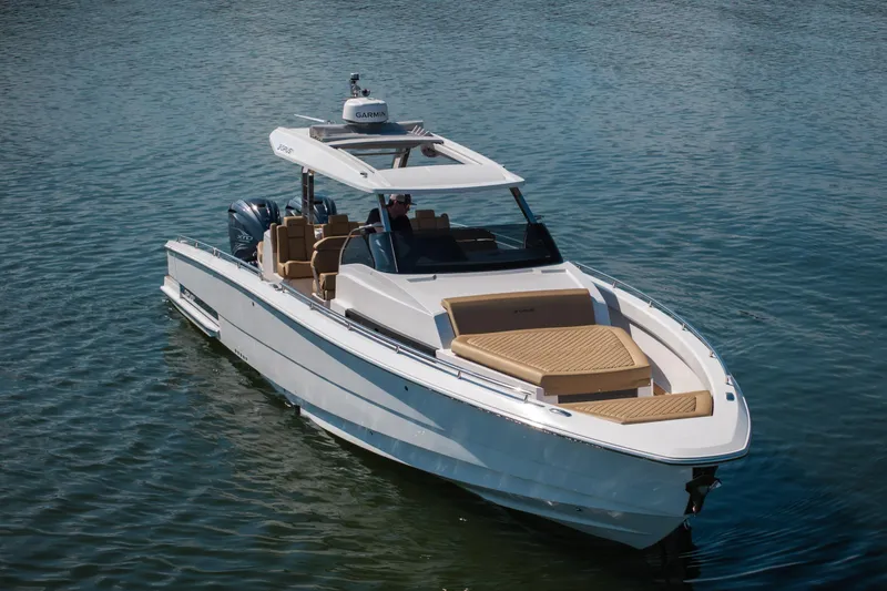 Slide: The Image of 2024 Opus OPUS 12 luxury boat cruising on calm water. - 3