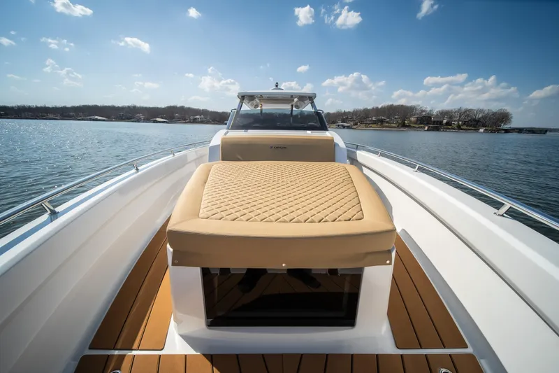Slide: The Image of Luxurious 2024 Opus OPUS 12 boat with cushioned deck, cruising on a sunny lake. - 30