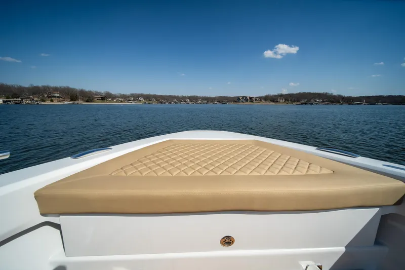 Slide: The Image of Bow view of 2024 Opus OPUS 12 boat with tan cushioned seating. - 31