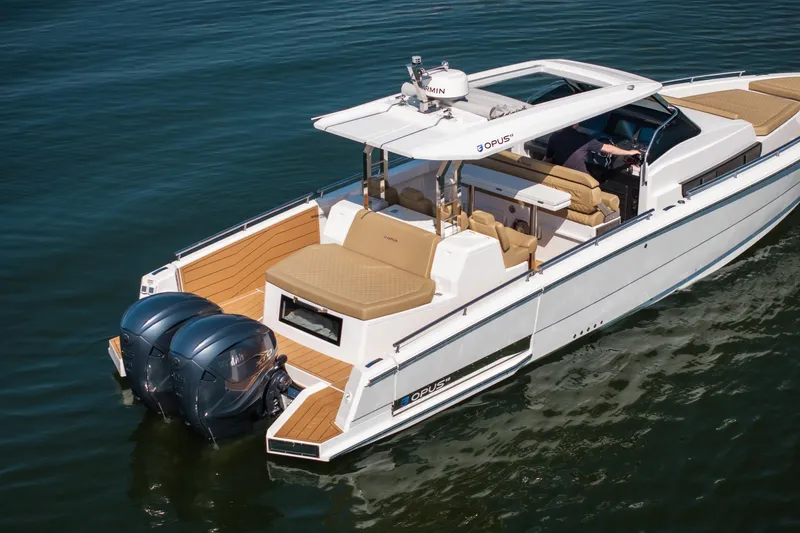 Slide: The Image of 2024 Opus OPUS 12 luxury boat with dual engines on calm water. - 4