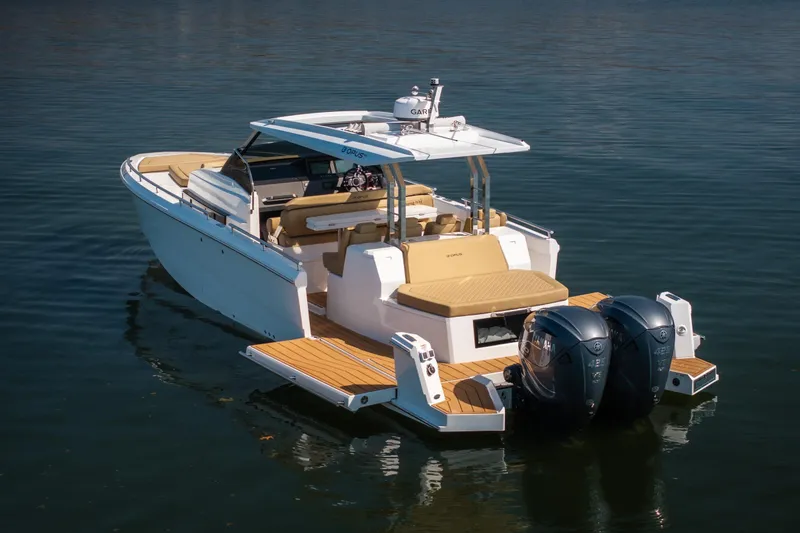 Slide: The Image of 2024 Opus OPUS 12 boat with dual engines on calm water. - 6