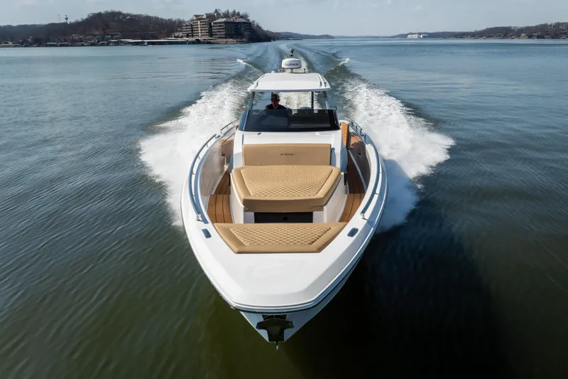 Slide: The Image of 2024 Opus OPUS 12 luxury yacht cruising on a serene lake. - 7