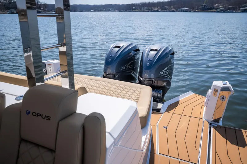 Slide: The Image of 2024 Opus OPUS 12 boat with dual Yamaha XTO outboard engines on a sunny lake. - 9
