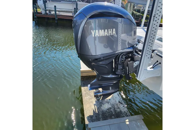 Slide: The Image of 2023 Sea Pro 248 Bay with Yamaha outboard motor on a boat lift. - 14