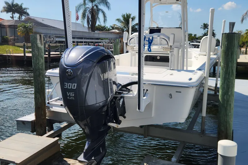 Slide: The Image of 2023 Sea Pro 248 Bay boat with Yamaha 300 V6 engine docked by waterfront. - 3