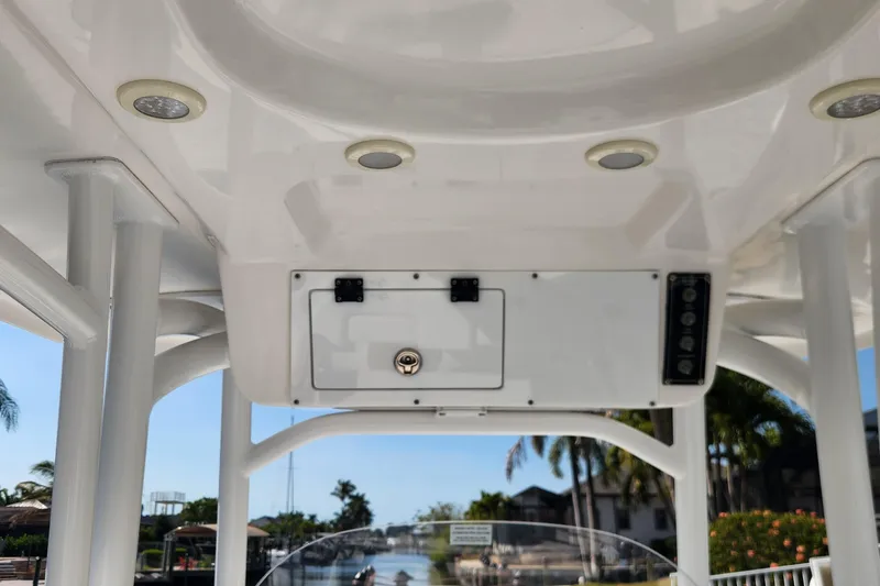 Slide: The Image of 2023 Sea Pro 248 Bay boat console with storage compartment and LED lights. - 31