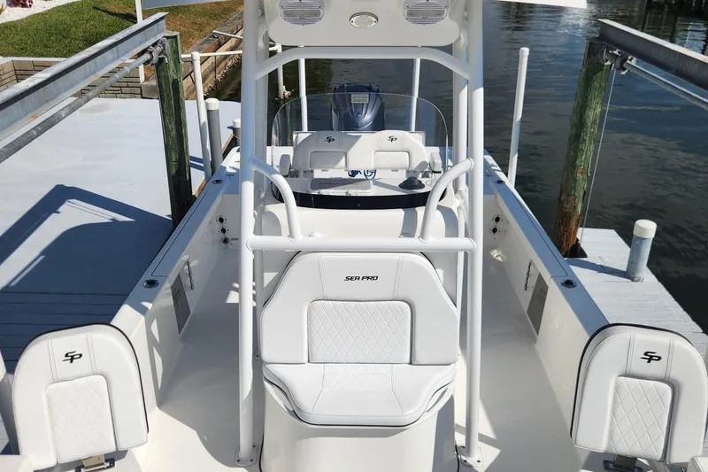 Slide: The Image of 2023 Sea Pro 248 Bay boat interior with white seating and console. - 33