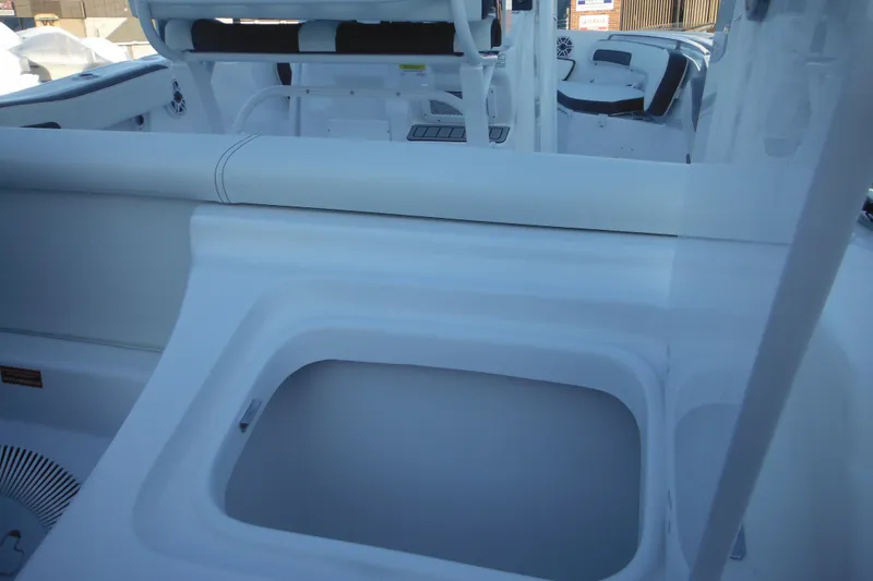 Slide: The Image of 2026 Tidewater 220 LXF boat interior with seating and storage compartments. - 14