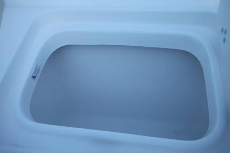 Slide: The Image of Storage compartment of 2026 Tidewater 220 LXF boat, featuring sleek design. - 15