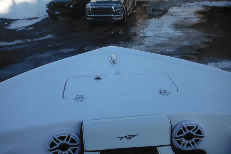 Slide: The Image of 2026 Tidewater 220 LXF boat bow with speakers and storage hatch. - 17