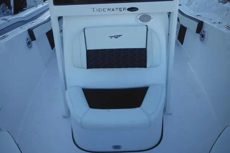 Slide: The Image of 2026 Tidewater 220 LXF boat interior with white and black seating. - 19