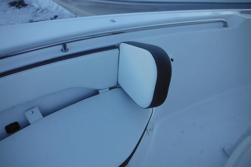 Slide: The Image of 2026 Tidewater 220 LXF boat interior with cushioned seating and stainless steel railing. - 22