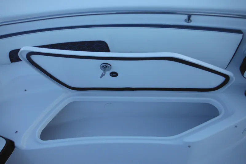 Slide: The Image of Open storage compartment on 2026 Tidewater 220 LXF boat, featuring secure lock and sleek design. - 30