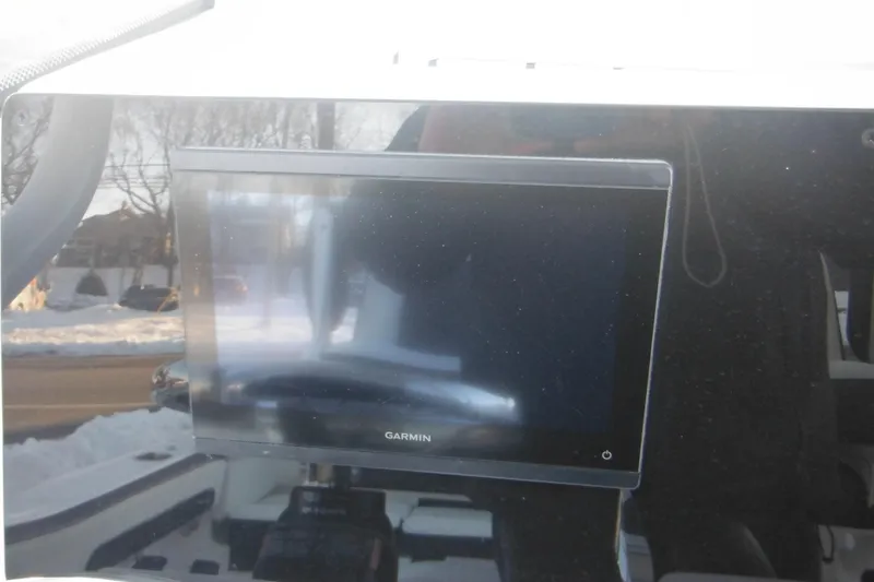 Slide: The Image of Garmin display on 2026 Tidewater 220 LXF boat dashboard, snowy background. - 39