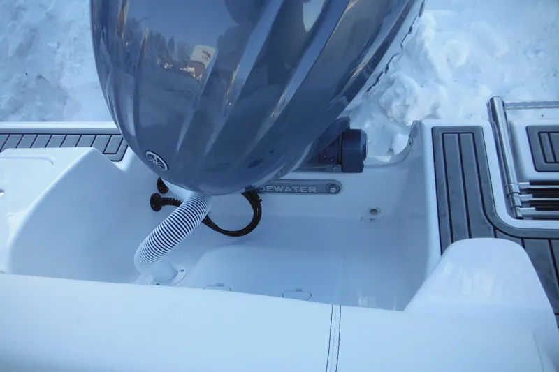 Slide: The Image of 2026 Tidewater 220 LXF boat engine and deck detail in snowy setting. - 43