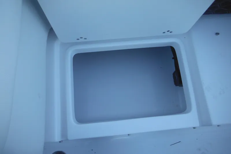 Slide: The Image of Open storage compartment on 2026 Tidewater 220 LXF boat. - 50
