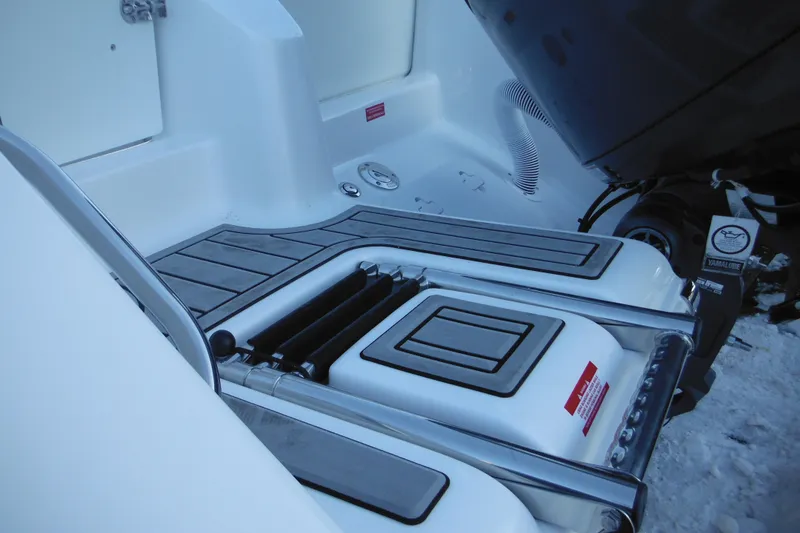 Slide: The Image of 2026 Tidewater 220 LXF boat deck with Yamaha engine detail. - 7