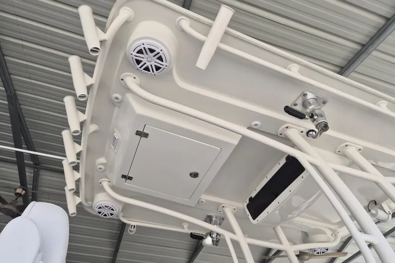 Slide: The Image of Underside view of 2025 Ranger 2600 Bay boat's T-top with rod holders and speakers. - 15