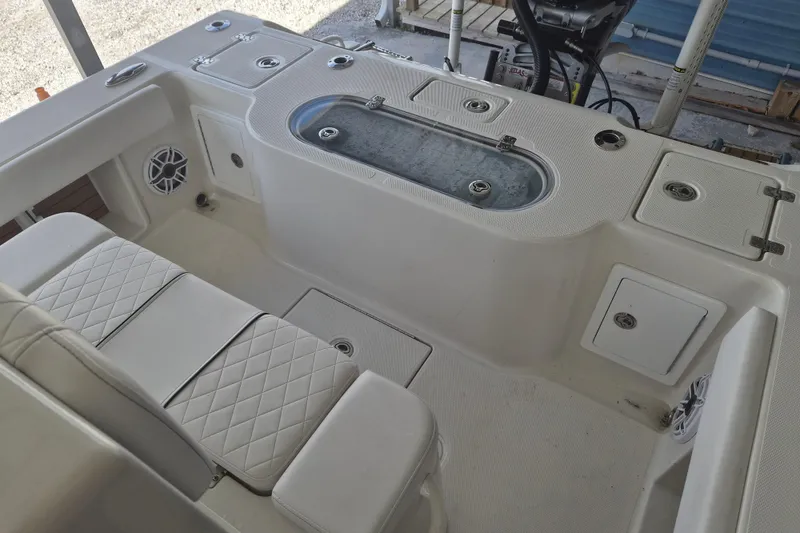 Slide: The Image of 2025 Ranger 2600 Bay boat interior with seating and storage compartments. - 6