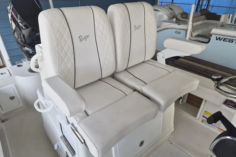 Slide: The Image of Luxury seating on 2025 Ranger 2600 Bay boat with white quilted upholstery. - 9