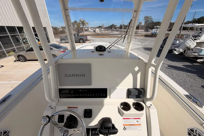 Slide: The Image of 2024 Cobia 262 Center Console boat dashboard with Garmin navigation system. - 17