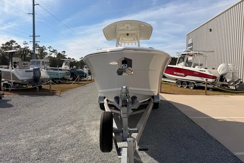 Slide: The Image of 2024 Cobia 262 Center Console boat on trailer at dealership. - 7