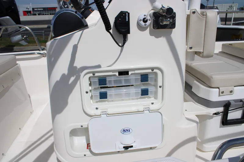 Slide: The Image of 2026 Boston Whaler 150 Montauk boat console with storage compartments and seating. - 17