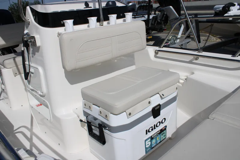 Slide: The Image of 2026 Boston Whaler 150 Montauk boat interior with Igloo cooler and seating. - 5