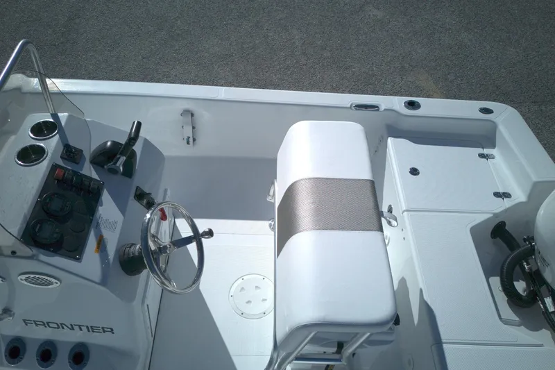 Slide: The Image of 2026 Frontier 180 boat interior with steering wheel and seating, showcasing modern design. - 6
