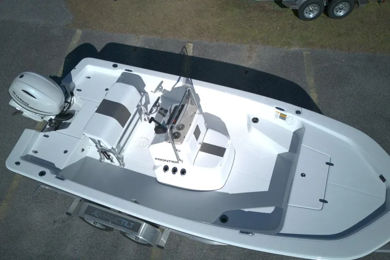 Slide: The Image of 2026 Frontier 180 boat with Yamaha engine, aerial view, parked on trailer. - 7