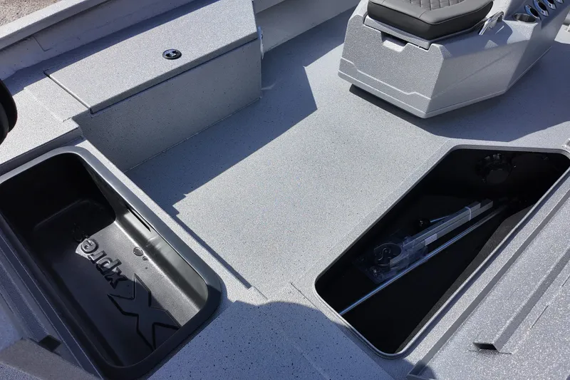Slide: The Image of 2026 Xpress H22B Bay boat interior with storage compartments and seating. - 13