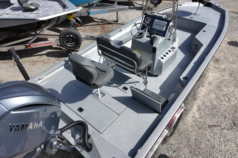 Slide: The Image of 2026 Xpress H22B Bay boat with Yamaha engine, featuring sleek design and modern controls. - 3