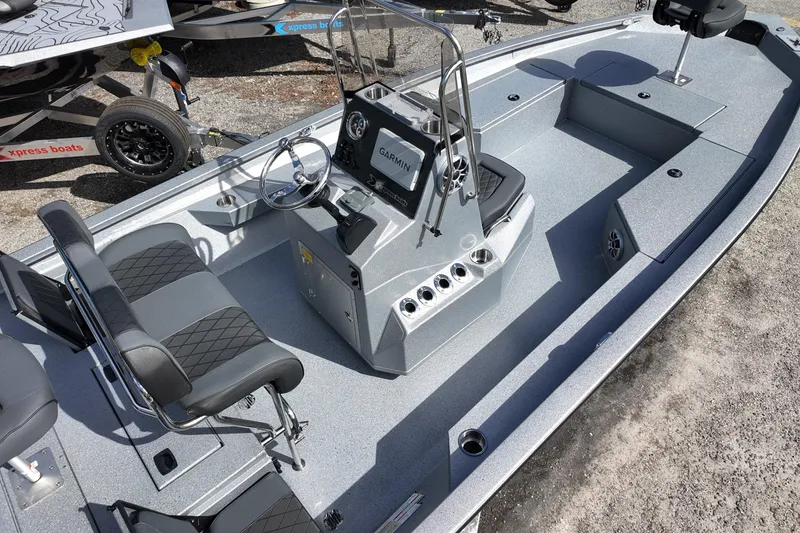 Slide: The Image of 2026 Xpress H22B Bay boat interior with steering console and seating. - 4