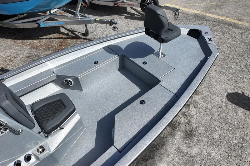 Slide: The Image of 2026 Xpress H22B Bay boat interior with seating and storage compartments. - 6