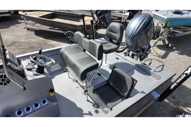 Slide: The Image of 2026 Xpress H22B Bay boat interior with seating and steering console. - 9