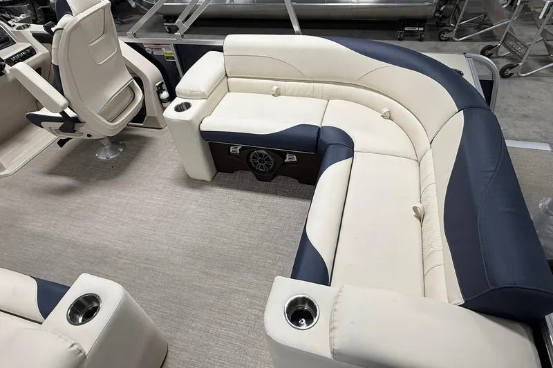 Slide: The Image of Luxurious seating in 2026 Avalon LSZ Elite 21' pontoon boat, featuring cup holders and premium upholstery. - 11