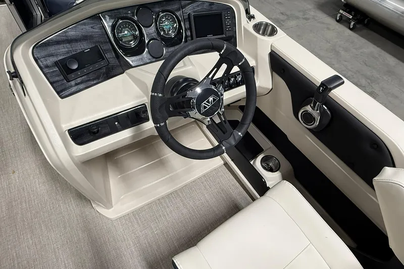 Slide: The Image of 2026 Avalon LSZ Elite 21' boat interior with modern dashboard and steering wheel. - 13