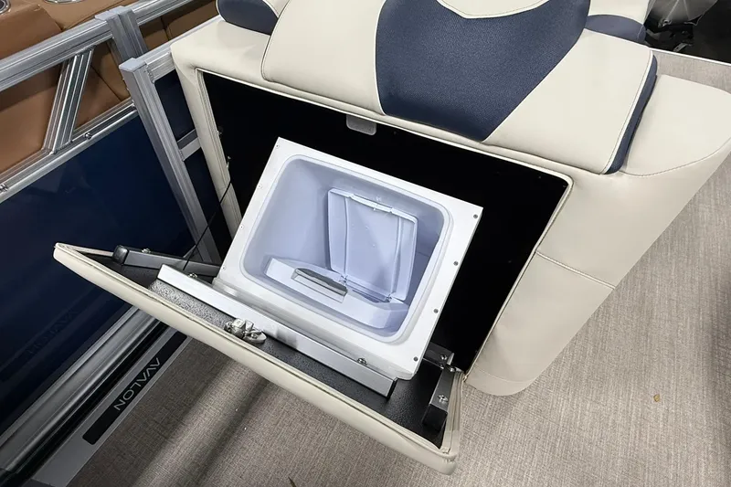 Slide: The Image of 2026 Avalon LSZ Elite 21' boat seat with built-in storage compartment open. - 16