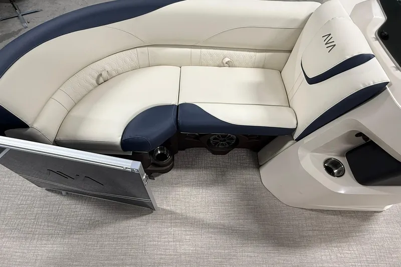 Slide: The Image of Luxurious seating in 2026 Avalon LSZ Elite 21' boat, featuring cream and navy upholstery. - 18