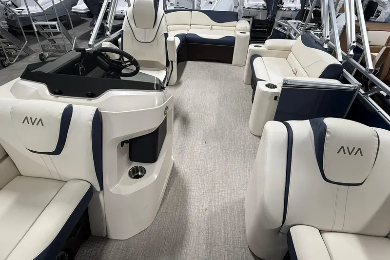 Slide: The Image of 2026 Avalon LSZ Elite 21' pontoon boat interior with luxurious seating and modern helm. - 19