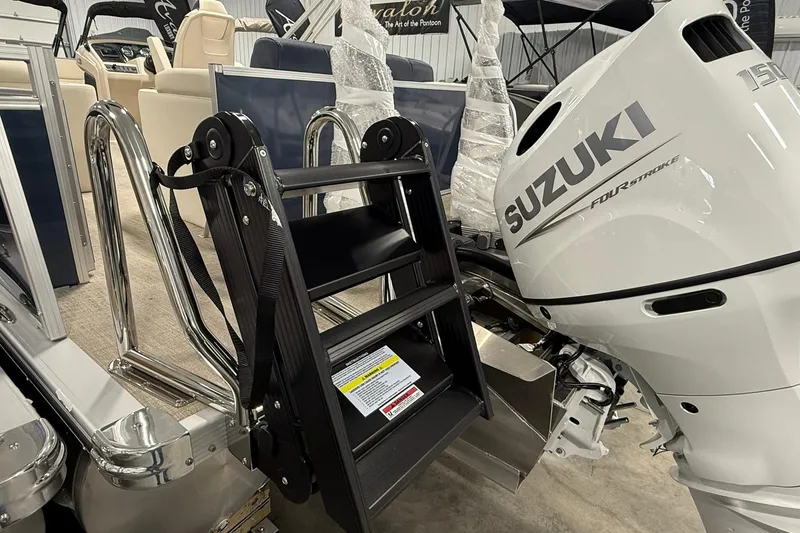 Slide: The Image of 2026 Avalon LSZ Elite 21' with Suzuki outboard motor and boarding ladder. - 8