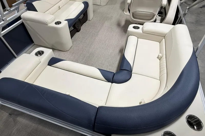 The Image of 2026 Avalon LSZ Elite 21' boat interior with luxurious seating and cup holders. - 9
