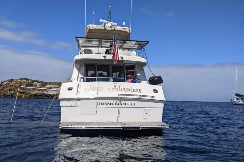 Slide: The Image of 2000 McKinna 48 Pilothouse yacht named "New Adventure" on the water near Channel Islands. - 1
