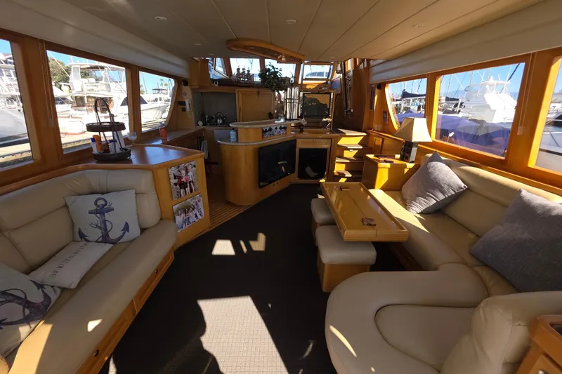 Slide: The Image of Luxurious interior of 2000 McKinna 48 Pilothouse yacht with elegant seating and decor. - 20