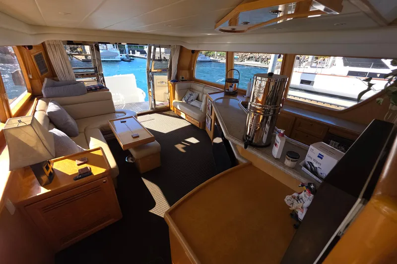 Slide: The Image of Luxurious interior of 2000 McKinna 48 Pilothouse yacht with elegant seating and scenic views. - 21
