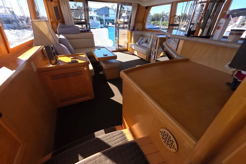 Slide: The Image of Luxurious interior of a 2000 McKinna 48 Pilothouse yacht with elegant wood finishes. - 29