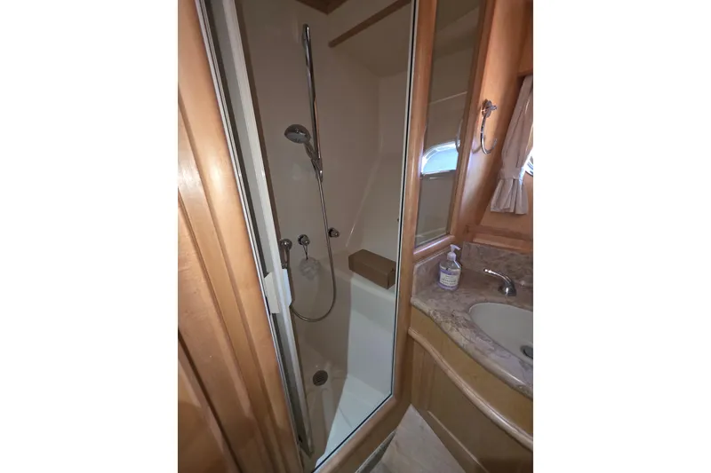 Slide: The Image of Bathroom interior of 2000 McKinna 48 Pilothouse yacht with shower and sink. - 44